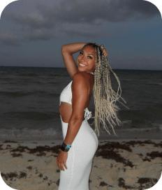 A woman in a white dress on the beach