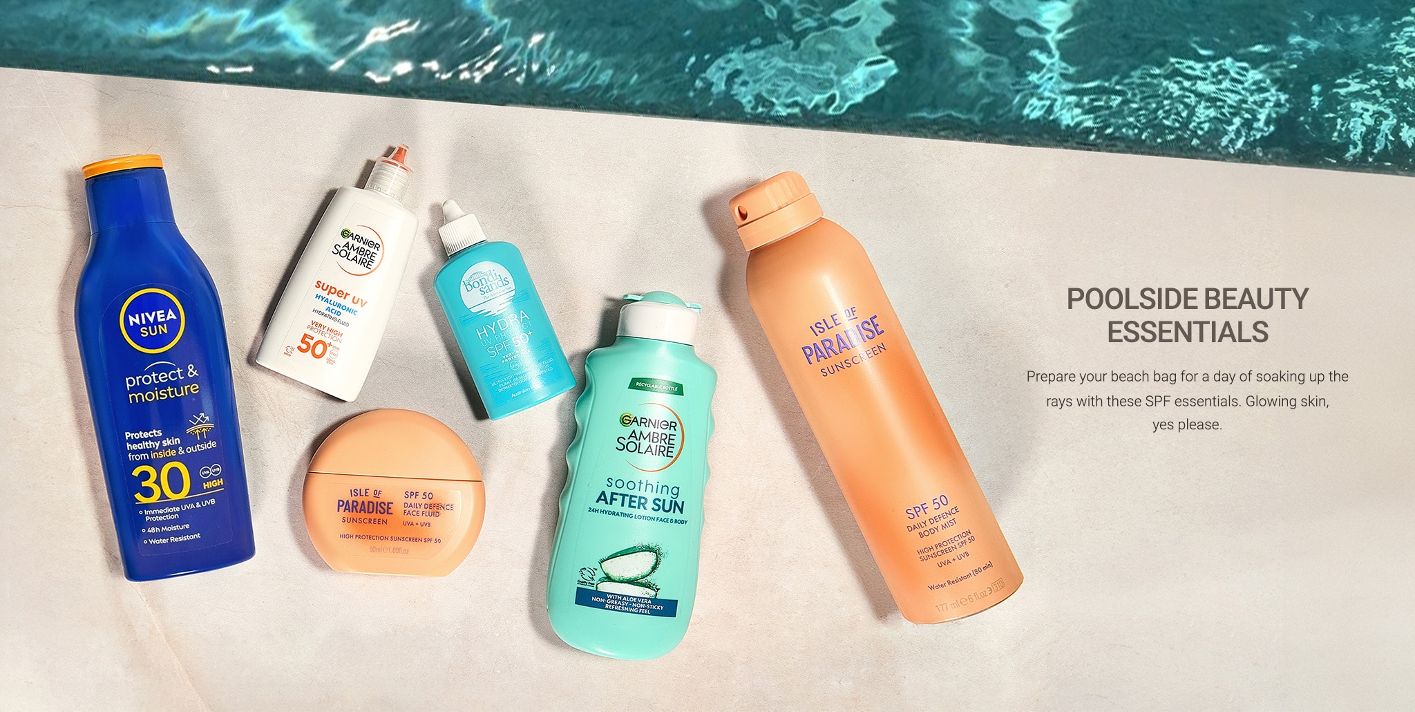 Bottles of suncare products on the side of a swimming pool