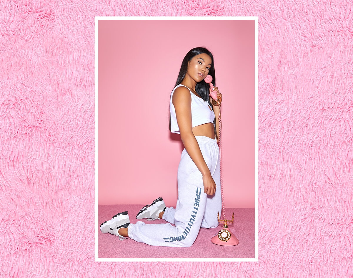 white cropped v neck basic shirt and prettylittlething grey jogger bottoms mobile